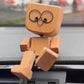 🎁Urocza mała drewniana figurka, która porusza się z 12 różnymi wyrazami twarzy